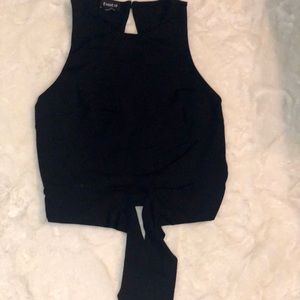 BLACK FRONT TIE HALTER CROP TOP FROM BEBE